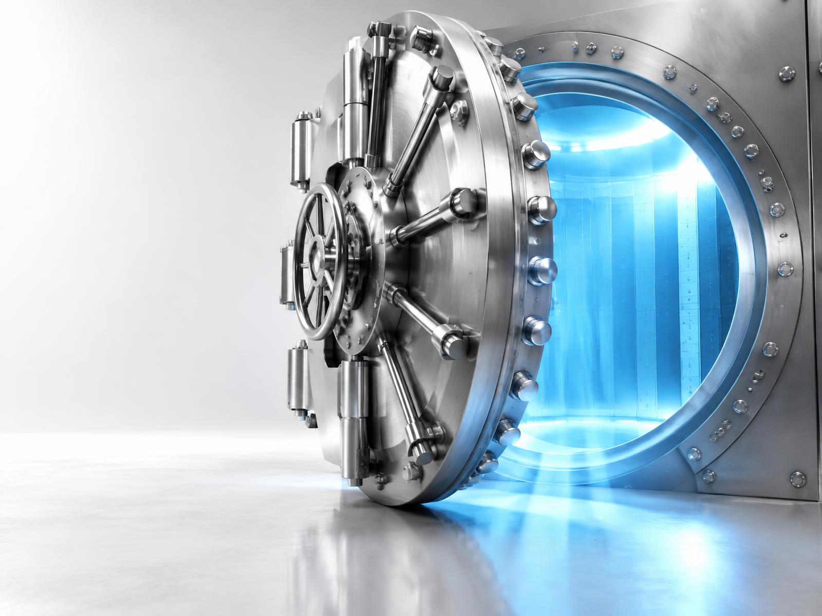 Open steel vault glowing with blue light